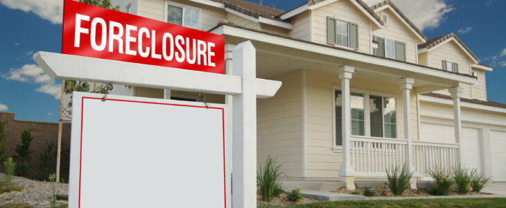 A house with a foreclosure sign