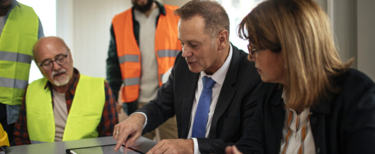 Board directors having a meeting with the team in the office at the construction site